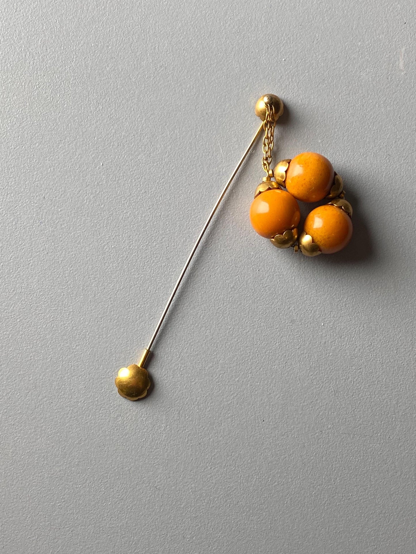A beautiful French art deco pin made with brass and amber, 1930s, Made in France