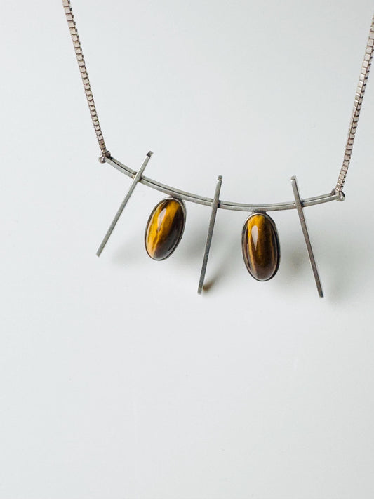 A very rare and big contemporary sterling silver pendant with tiger eyes designed by Finnish jewelry designer Eero Eskelinen in 1959