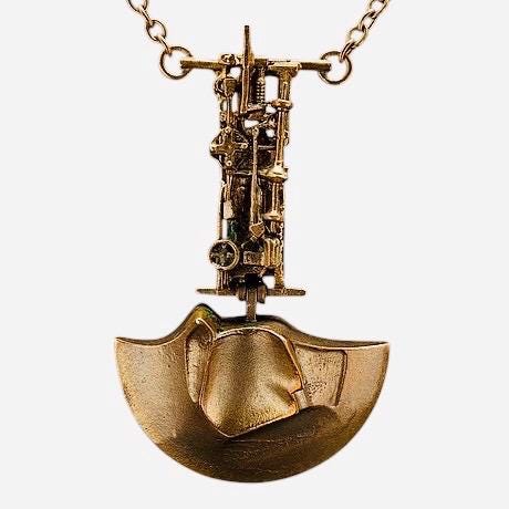 With Original box/ Modernist bronze pendant named General Motors, designed by Björn Weckström for Lapponia. Made in Finland, 1970s